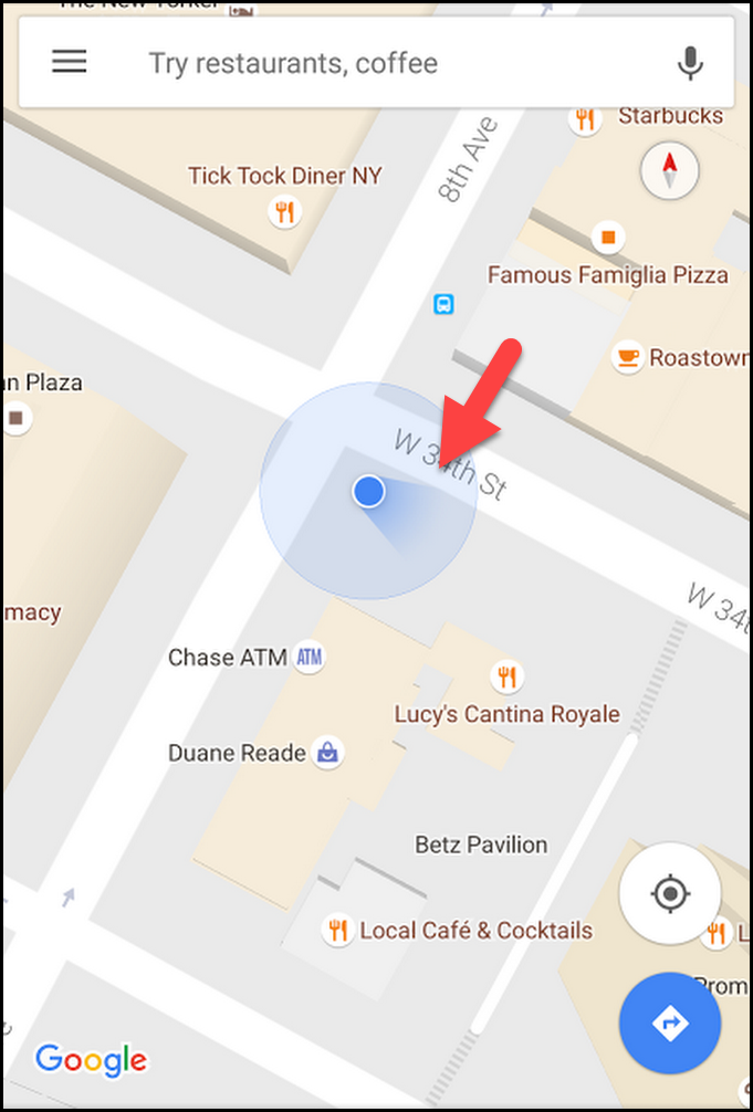 Mobile screenshot of Google Maps with the blue indicator pointing down and to the right.