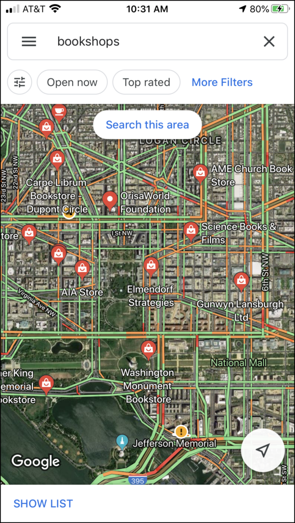 Mobile screenshot of Google Map showing bookstore locations around the White House in Washington DC.